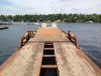 1990 60’ x 16’ x 6’ Steel Deck Barge with Ramps, Spud wells and Spuds